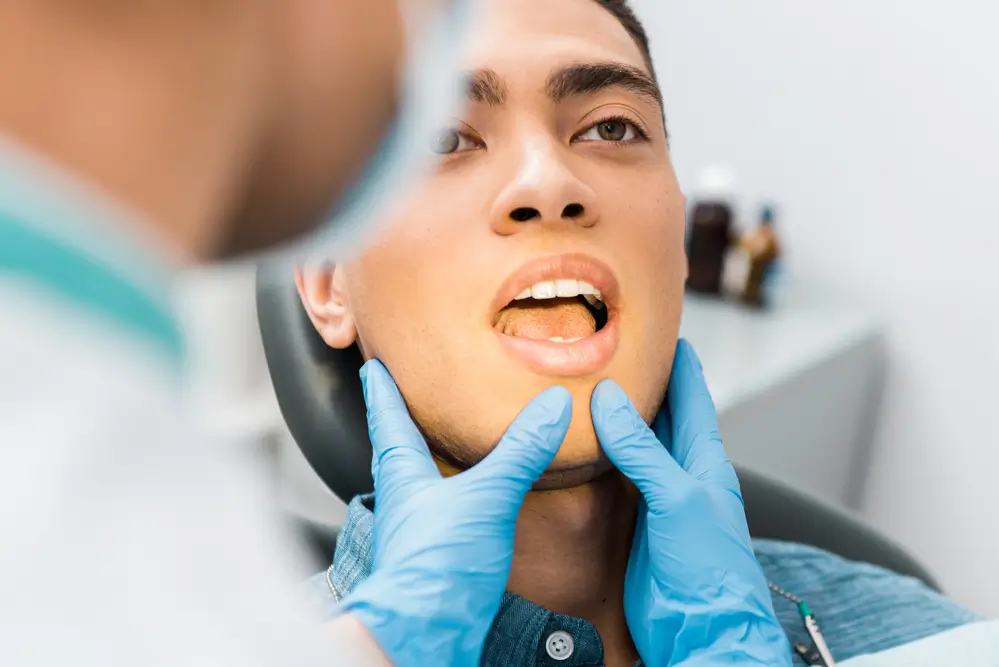 A dentist examining a patients mouth